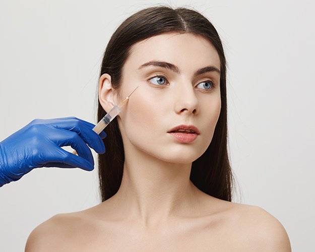 Injectable treatment being given to a patient's cheek